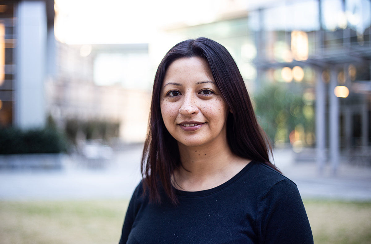 TPS holder, Roxana displays a warm smile.