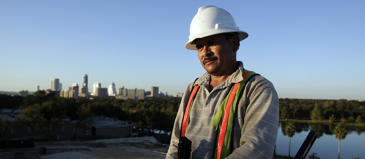 A construction worker helps build a 375 apartment building in Austin, Texas, November 5, 2009.