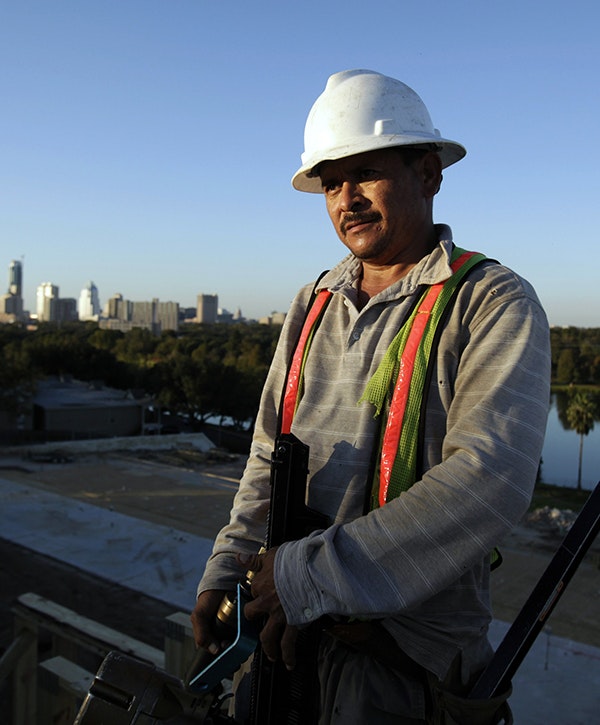 A construction worker helps build a 375 apartment building in Austin, Texas, November 5, 2009.