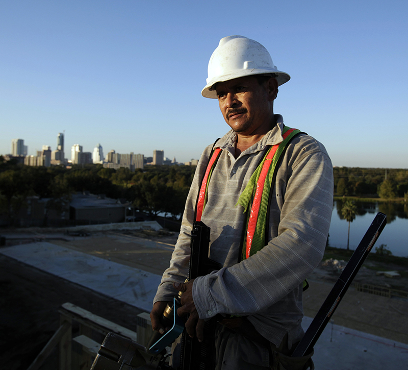 A construction worker helps build a 375 apartment building in Austin, Texas, November 5, 2009.