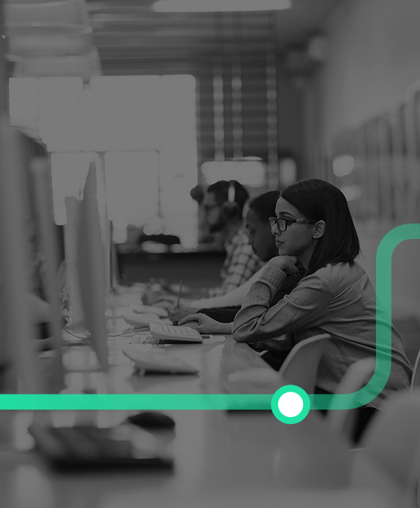 Shot of a group of university students working on computers in the library at campus