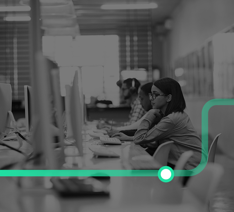 Shot of a group of university students working on computers in the library at campus