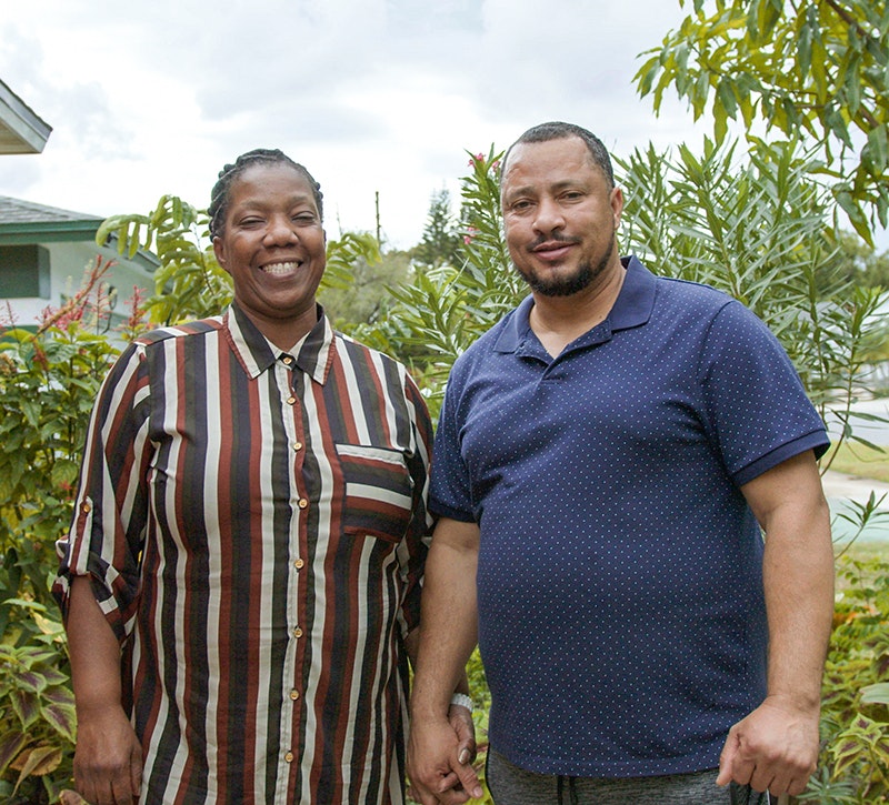Haitian Temporary Protected Status holder, Wilma, standing outside next to her partner