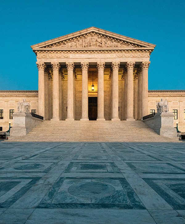 The Supreme Court building, also know as the Marble Palace, glows in the afternoon light before ruling on Remain Mexico or MPP in the Biden v. Texas case