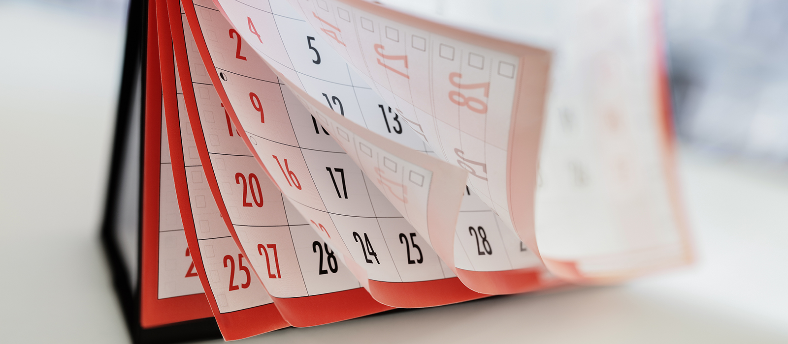 A calendar flipping through many pages.