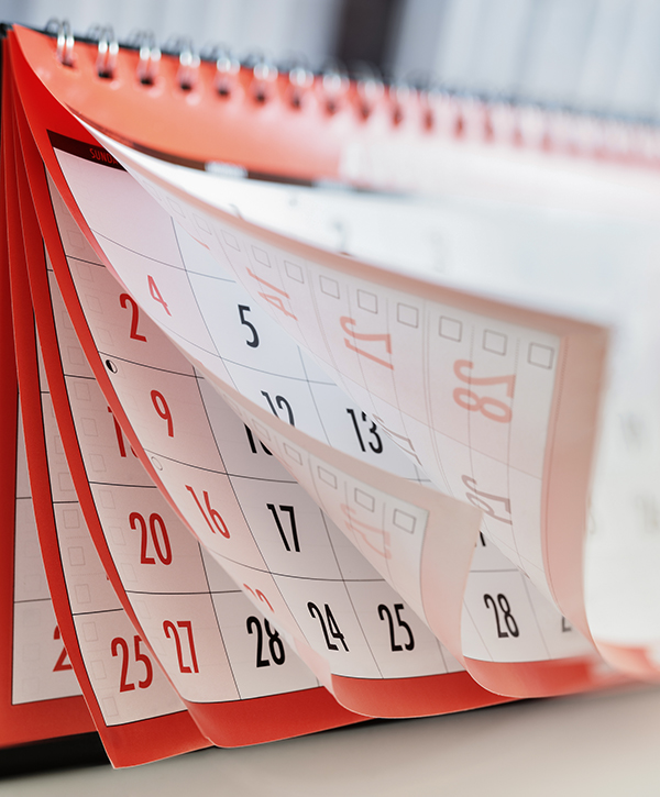 A calendar flipping through many pages.