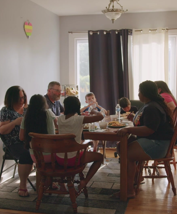 A family sits around the dinner table